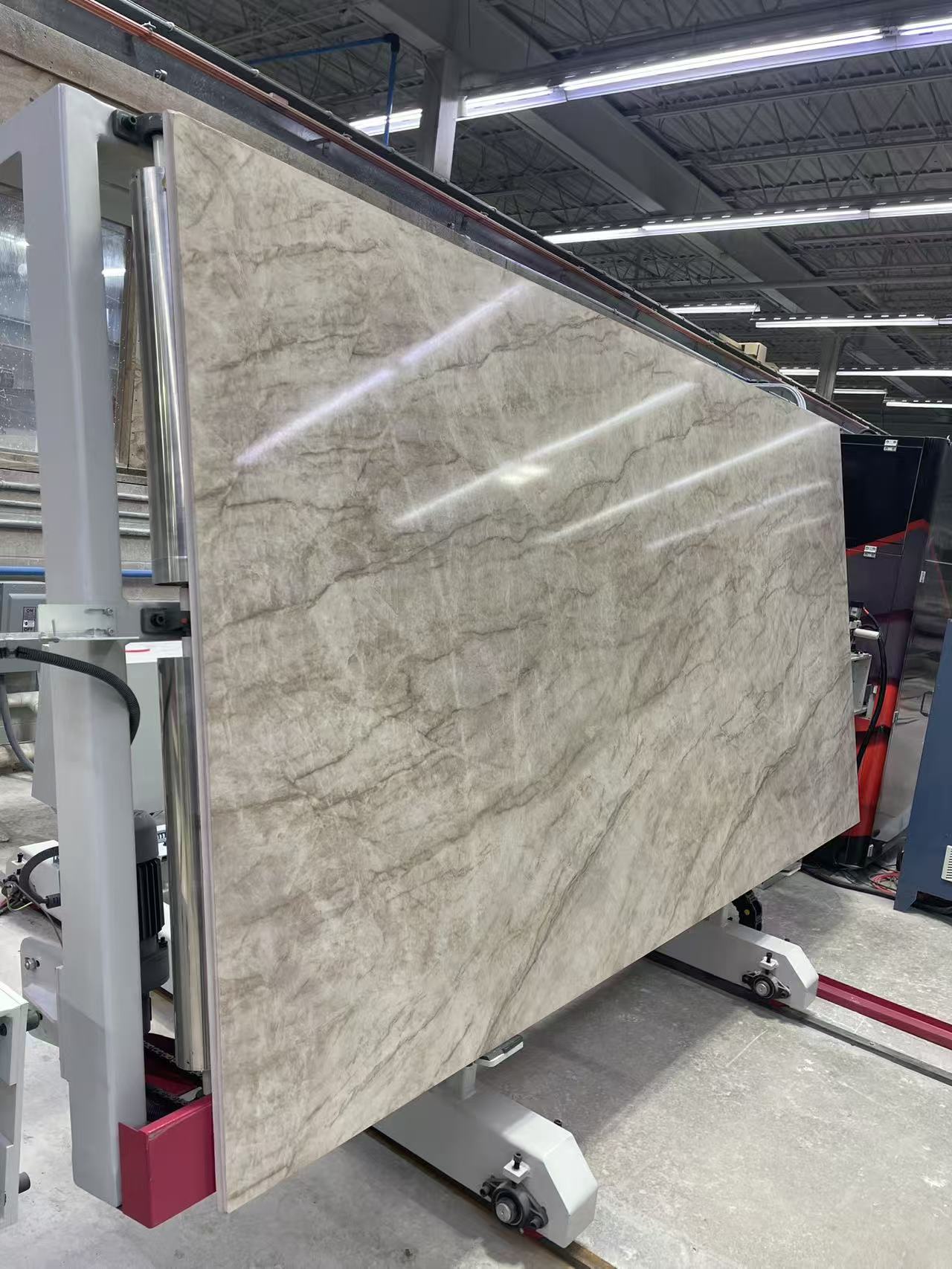 A large veined surface displayed upright in the production area.